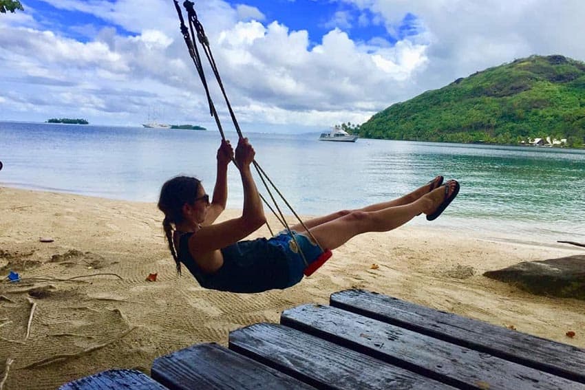 Michelle swinging after lunch on Taha’a, Tahiti. Aaron Pribble photos.