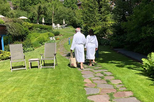 Bathrobes are the normal attire in the garden near the pool at Adler Dolomite Resort and Spa.