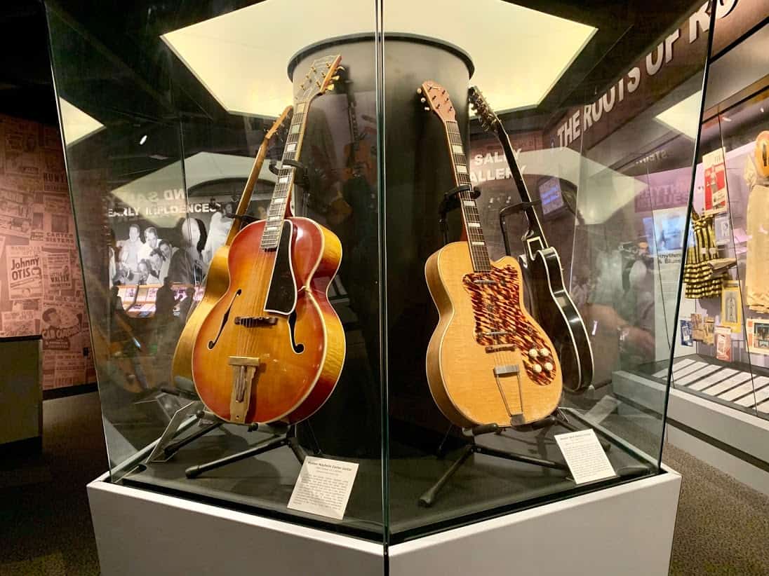 Guitars used by music legends are displayed in the Rock and Roll Hall of Fame museum.