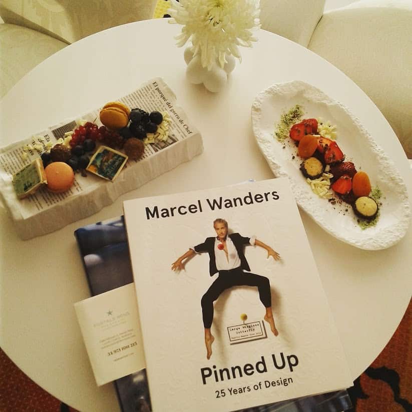 Cover of Marcel Wanders’ design book on table of goodies