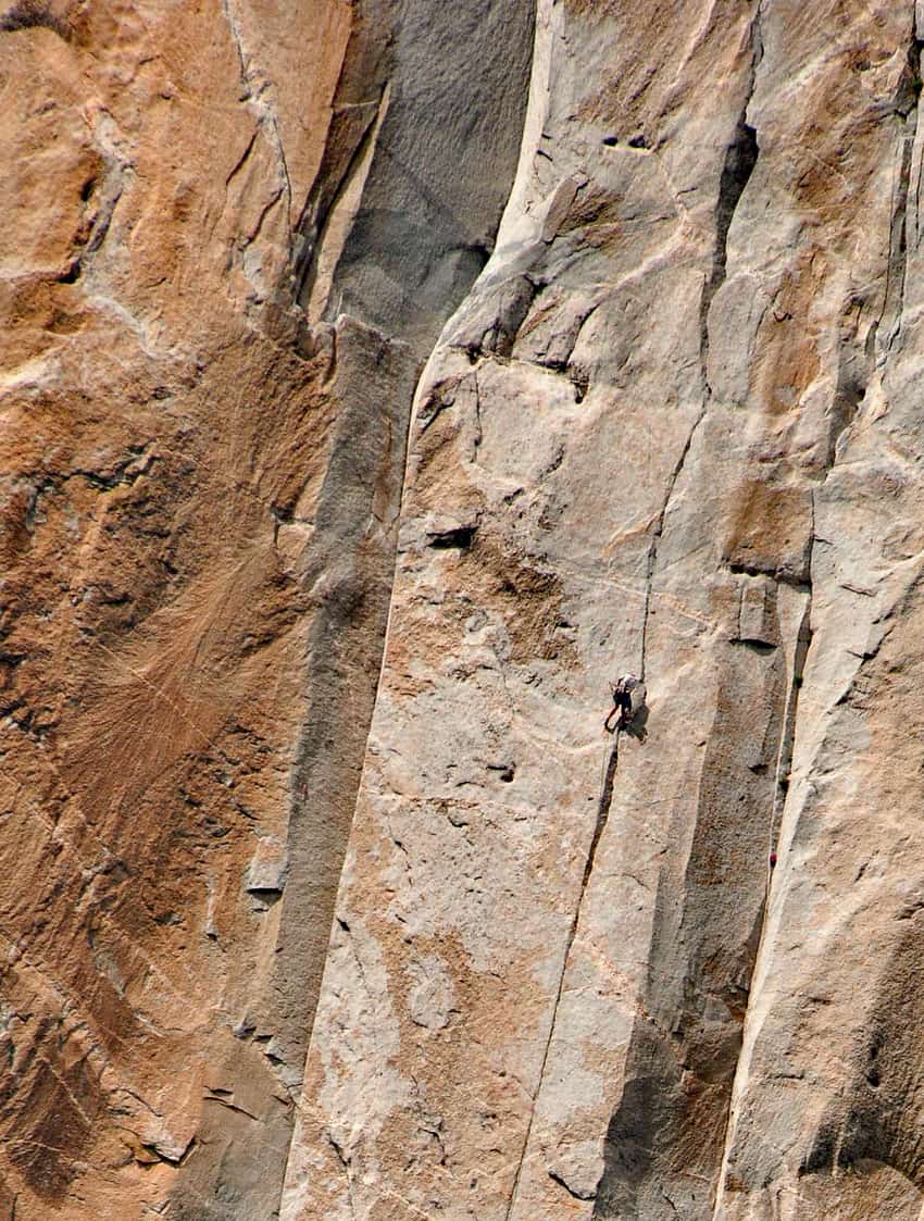 A rock climber makes his way along the face of El Capitan.