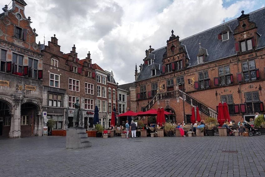 The town center in Nijmegen has buildings that date back to the 16th century, such as De Wagg, right, a popular restaurant where tables outside are the best seats in the house on a nice evening.