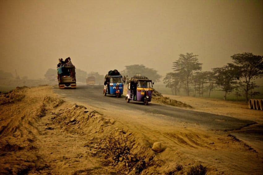 Rickshaws on a sandy road