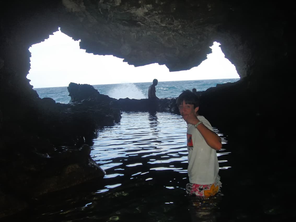 Natural pool with opening at Animal Flower Cave