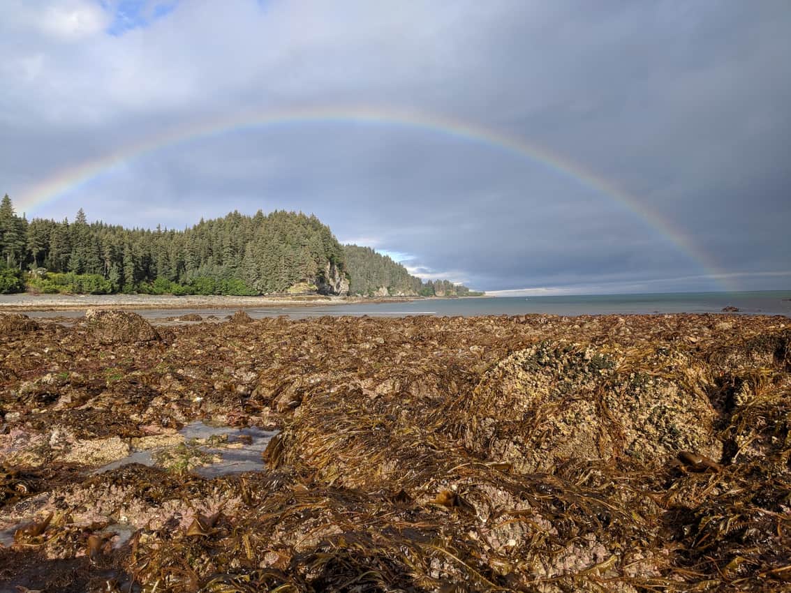 MacDonald Spit rainbow over the beach. Between Beaches