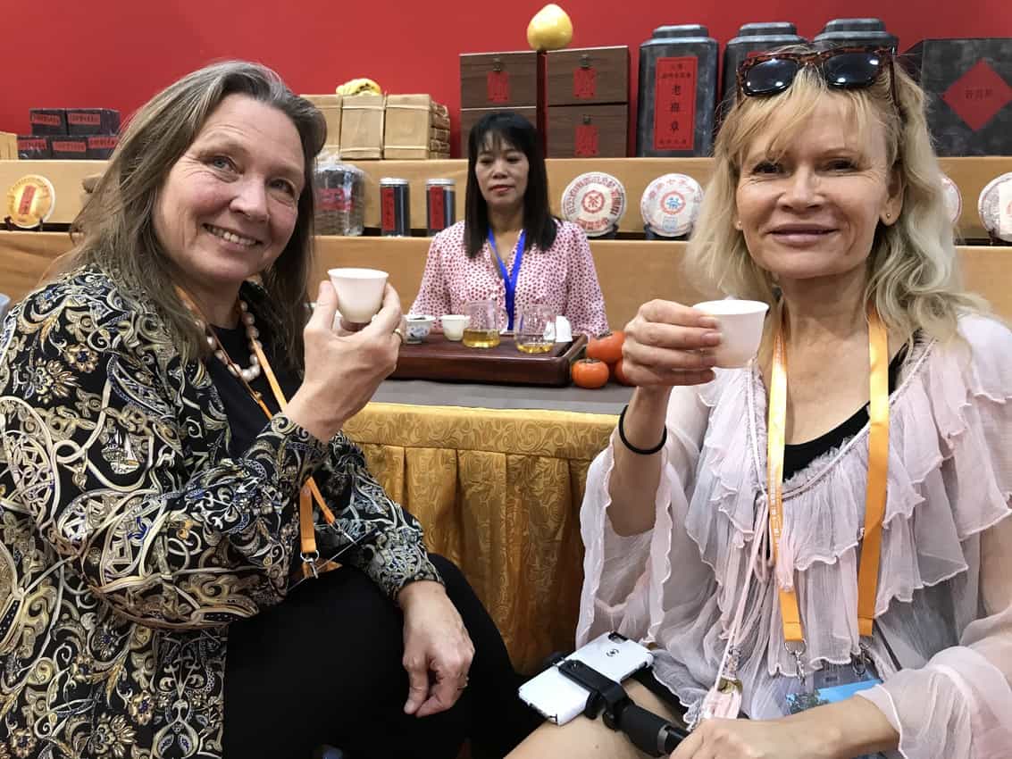 Friends Sanna and Gitte enjoy Chinese tea inside the Expo.