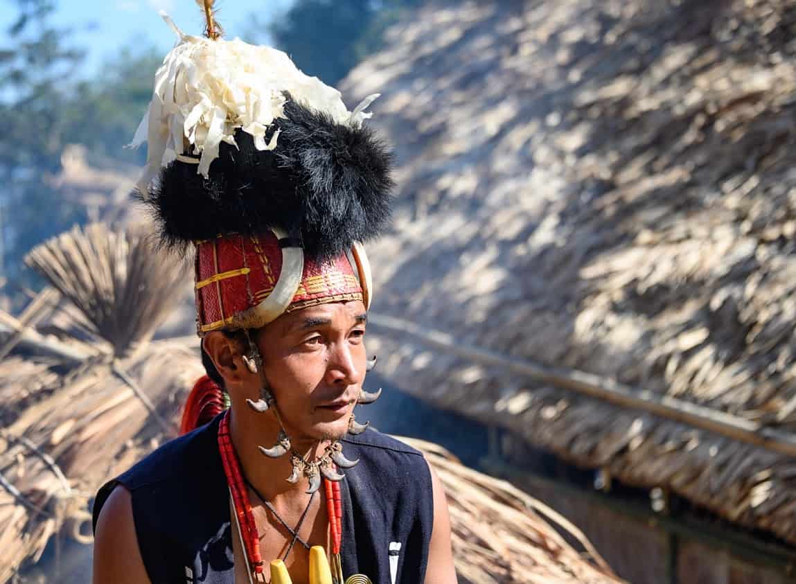A Sangtam tribal warrior takes a break from the dancing. Each tribe has their own distinct dress.