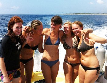 The author, center, about to lead her first group of divers as part of her divemaster certification.
