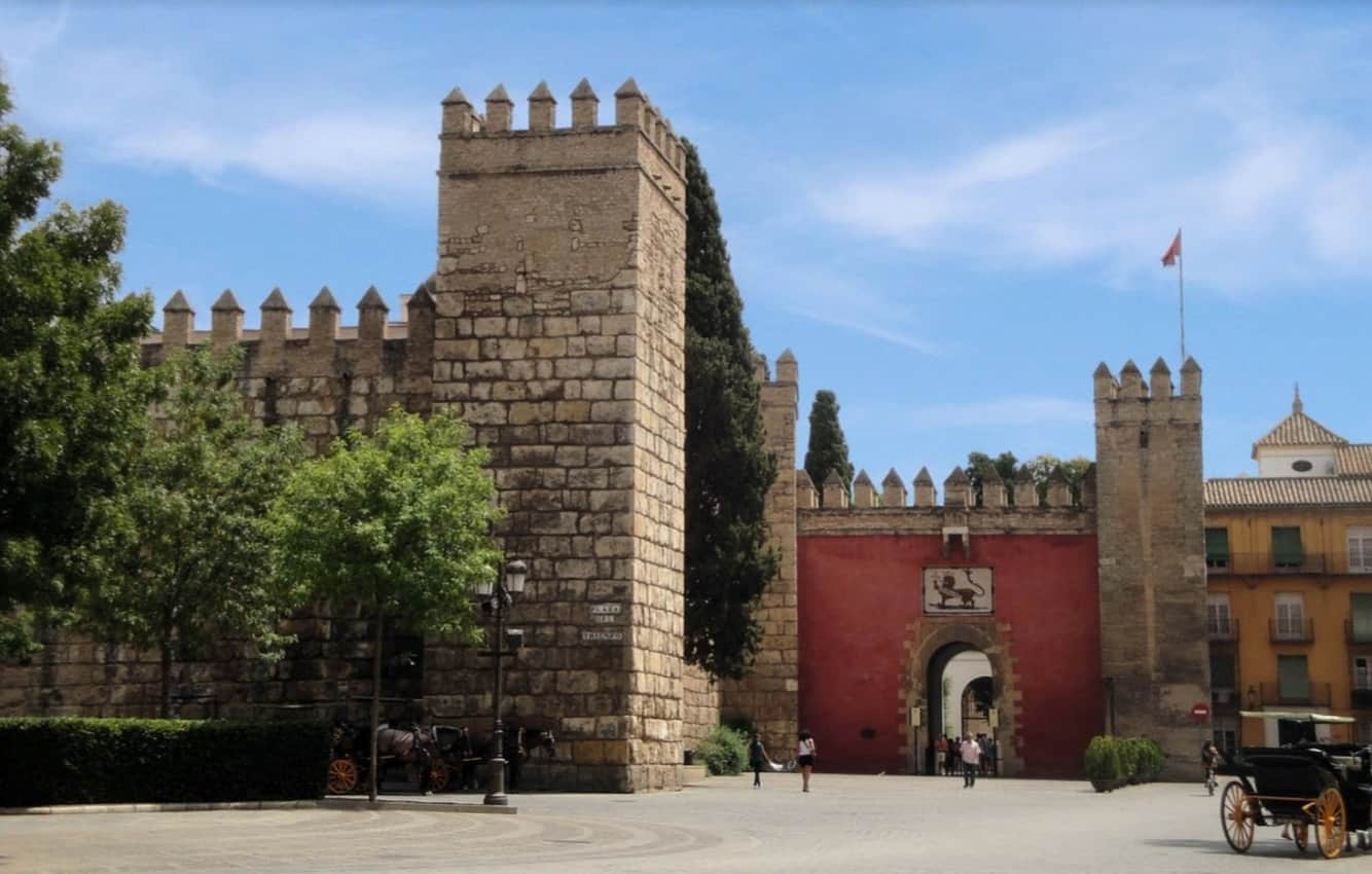 Sevilla Castle walls which guarded the city in medieval times and entrance to the Real Alcázar.
