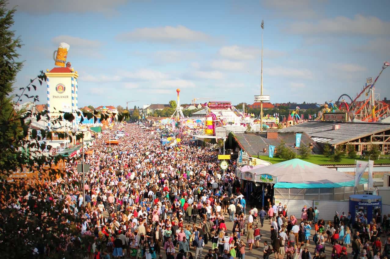 The giant, beer-drinking crowd at Munich's famous Oktoberfest. Don't carry too much cash.Pexels photo.