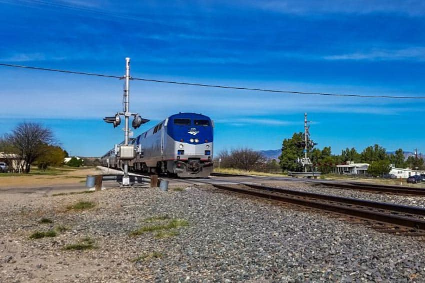 Amtrak train approaches a crossing