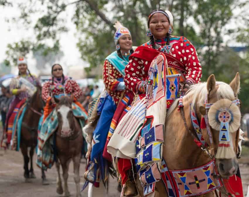 Unique to the Crow Fair is a spectacular parade featuring hundreds of Crow Indians, many on horseback, slowly making their way thru the powwow grounds.