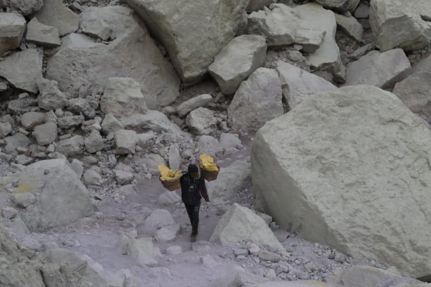 A miner carries sulphur out of the Ijen Crater in East Java, Indonesia. Caitlin Ashworth photos.