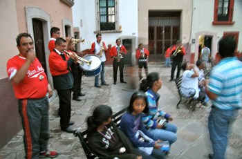 The callejoneada, a traditional street party, draws crowds of 30 to 40 Mexican revelers who come to drink and dance around town.