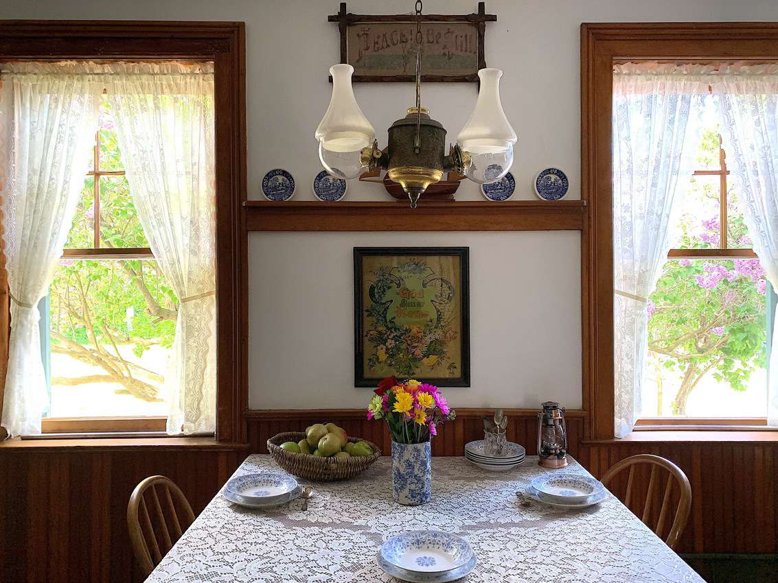 The small dining room table offers a nice window view.