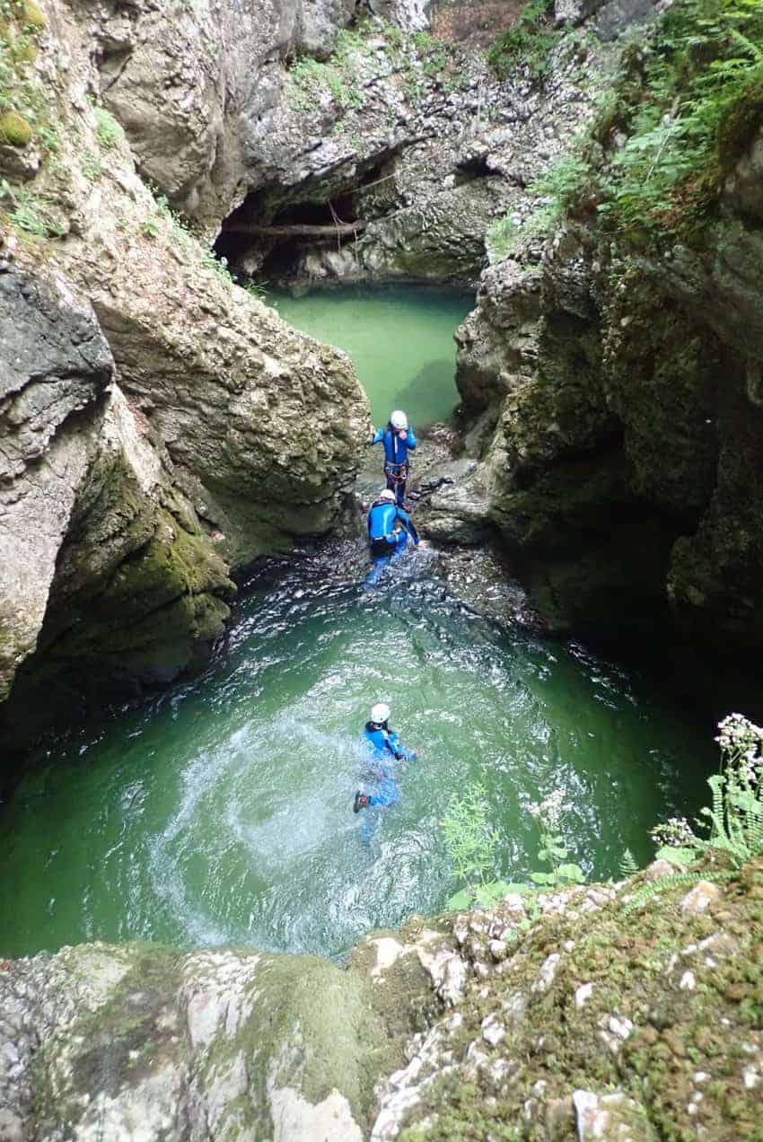 swimming through chilly rock pools canyoning in Slovenia