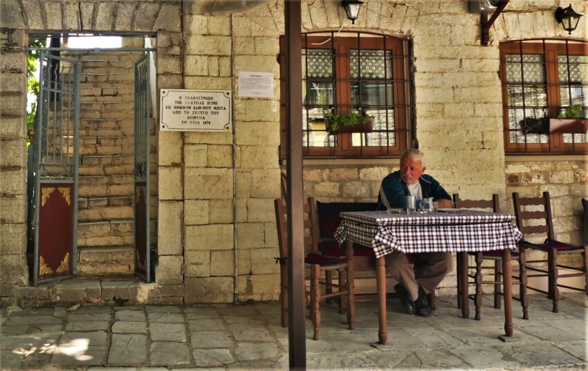 man at the table in a village in the Athamanic Mountains.