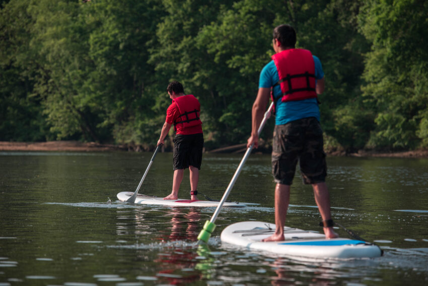 Brothers paddle boarding. Visit Prince Williams Virginia.
