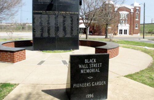 Black Wall Street Memorial with historic Vernon A M E Church in background Photo by Beth Reiber