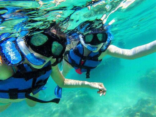 Snorkeling with Friends in the Waters of Xel Há