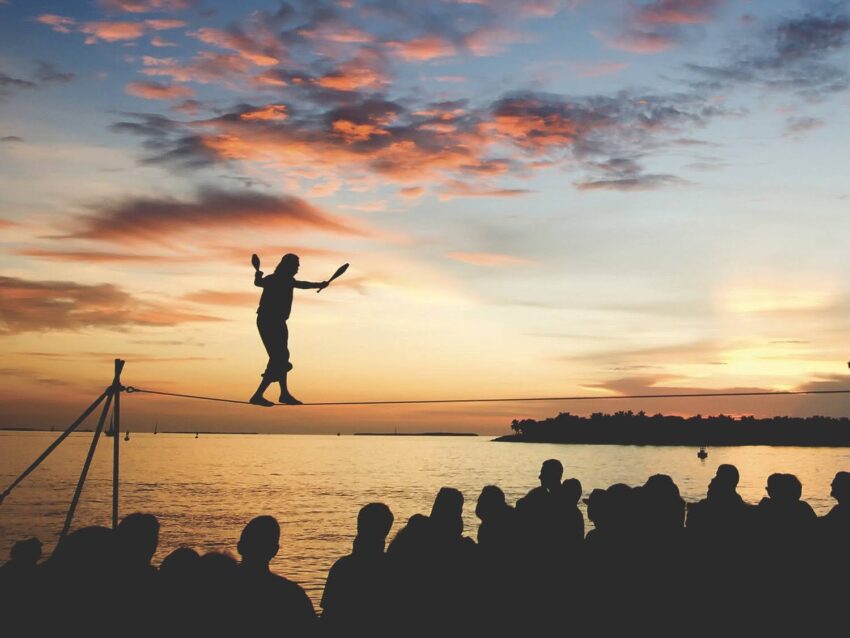 Busker Will Soto walks a tightrope at the sunset celebration in Key West, Fla. The sunset celebration at Mallory Square is a daily ritual for visitors to this subtropical island at the bottom of the Florida Keys island chain. Photo by Bob Krist/Florida Keys News Bureau