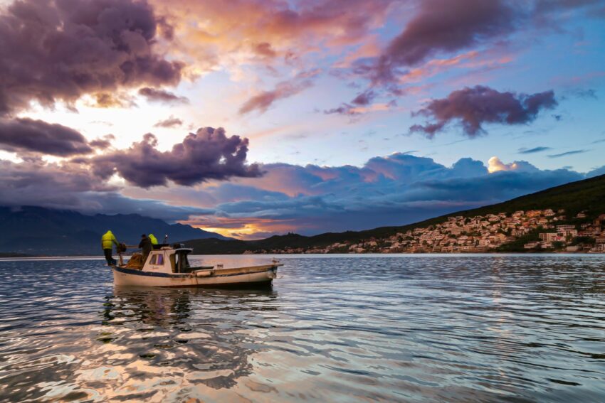 Fishermen in action at sunrise in the Bay of Tivat, Montenegro.