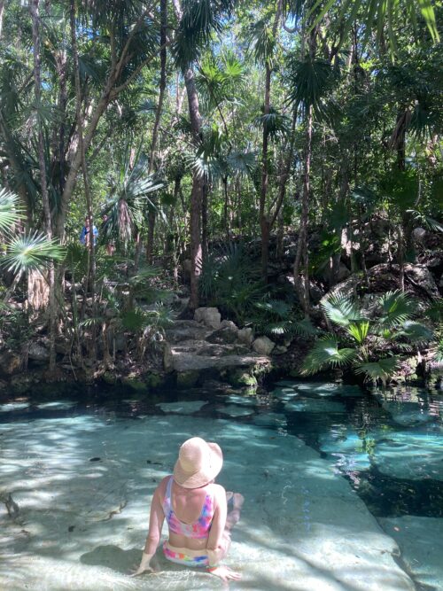Alyssa Pinsker  in a cenote, the Cenote Azul, in Tulum