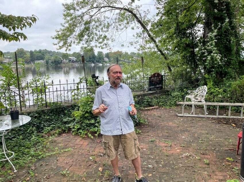 Peter Prorok stands outside his art and antiques gallery along the Delaware River in Lambertville