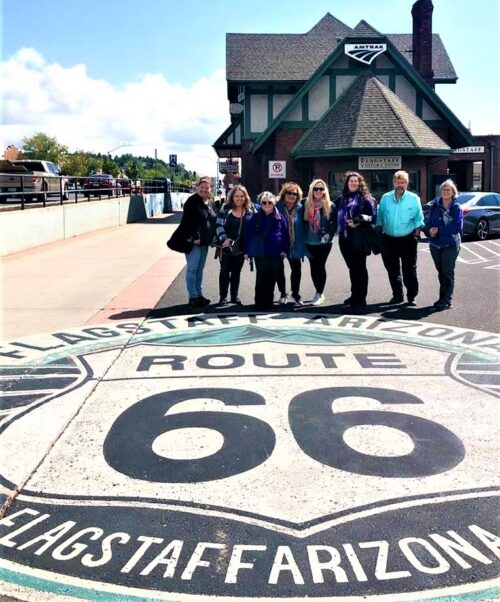 Friends Gathering at the Route 66 Sign at the Flagstaff Train Station