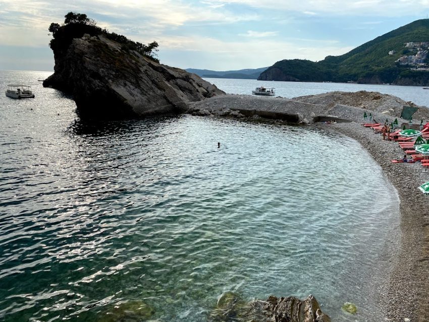 The three beaches of Sveti Nikola are rocky, and tourists often rent cushions to relax in the sun for an afternoon away from the noise of Budva.