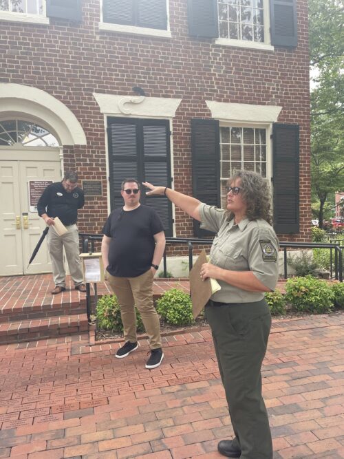 Charlotte Lindsey, a tour guide for the Department of Natural Resources, leads the Crime and Punishment Tour that commences at the Gold Museum.