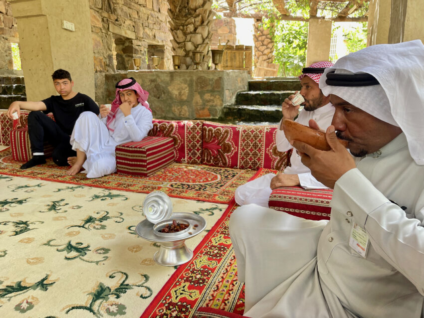 Enjoying dates and tea at the farm in Tayma, Saudi Arabia.