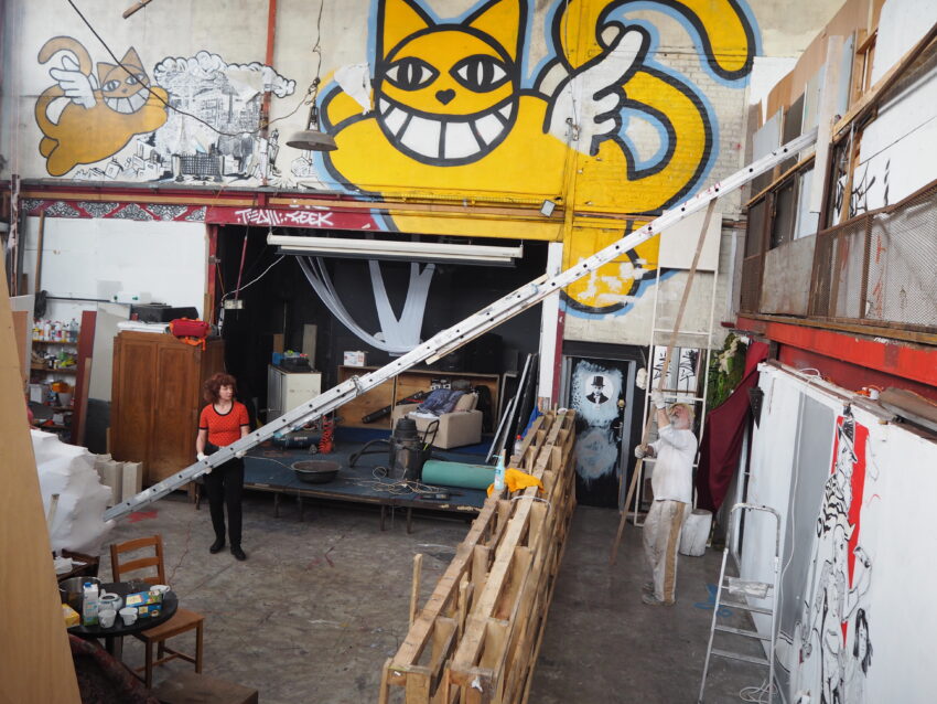 Monsieur Chat (street art) on the walls of Albatros Studios in Montreuil. The artists prepare for the open door festival.