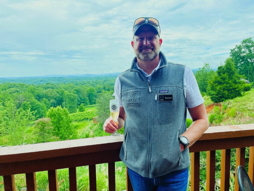 Winemaker Brannon Boegner enjoys a glass of his award-winning Blanc de Blanc at Wolf Creek Vineyards.