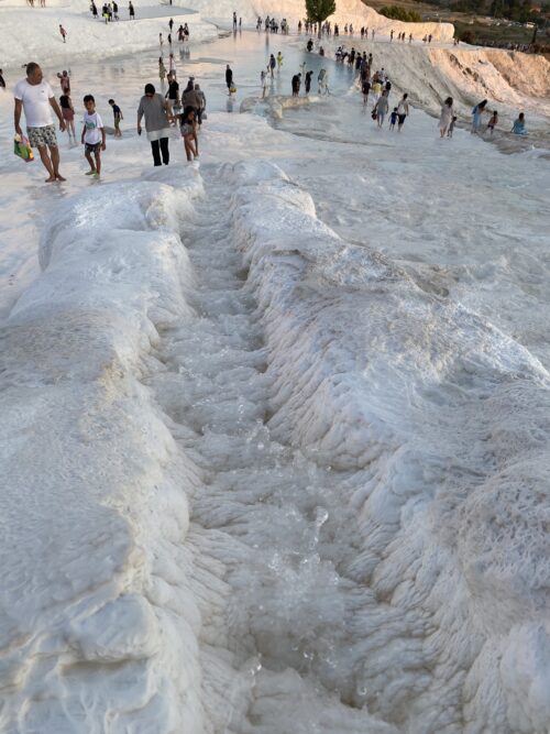 The form and texture of the surface ranged all the way up the 200 meter hill, from steep basins that I could walk in up to my knees, to porous puffs of hardened channels for water streaming downwards.