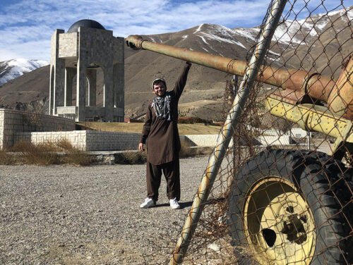 SOVIET LEFTOVERS- An abandoned Soviet artillery piece in the Panjshir Valley. Massoud's tomb is in the background.