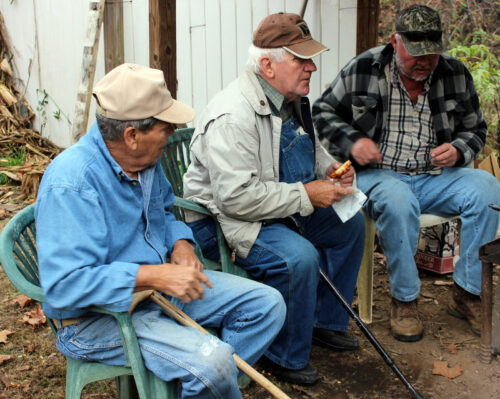 Local men catch up with the news in Franklin, North Carolina. Wynne Crombie photos.