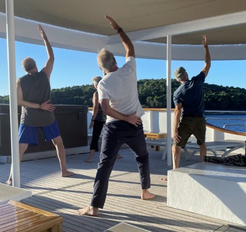 Yoga class on the top deck of the Fortuna. Jeri Linas photo.