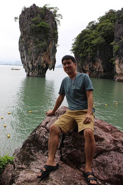 The author (Chin Liang) posing in front of the iconic rock in James Bond Island
