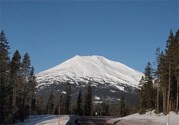 Mount Bachelor shows its snowy dome, with skiing around the entire perimeter of the big former volcano.