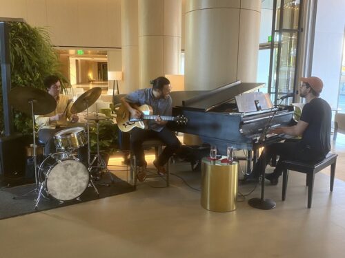 A trio plays in the lobby