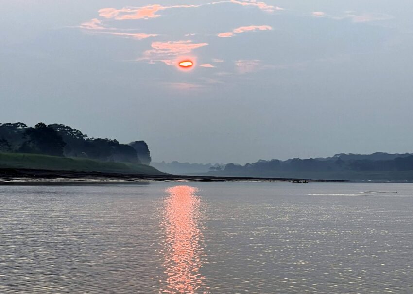 Sun sets over the Amazon River in Colombia.