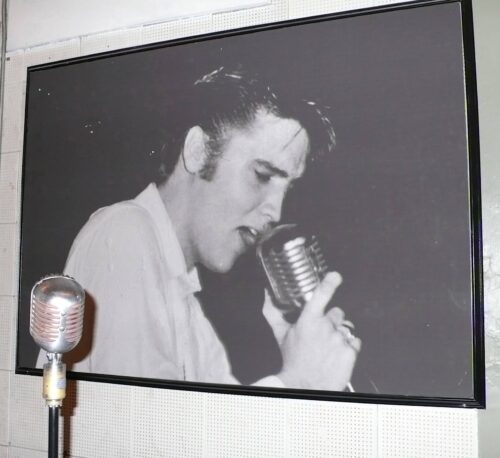 Visitors can take photos holding an old Elvis-era microphone.