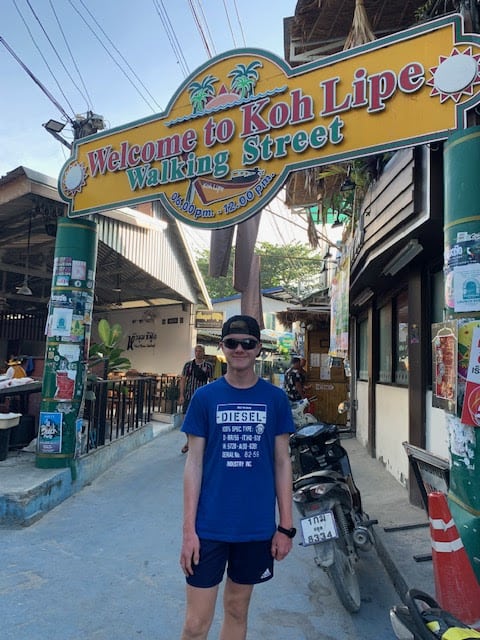 Me at the entrance to bustling Walking Street, Koh Lipe's main thoroughfare.