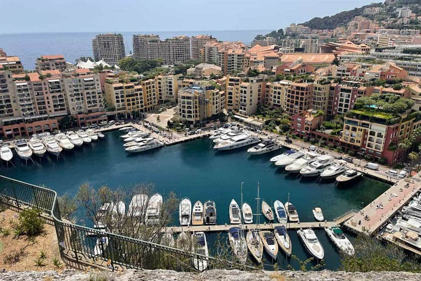 Monaco's grand harbor is full of huge luxury yachts and is the center of the city of Monte Carlo perched on hills. Max Hartshorne photos.