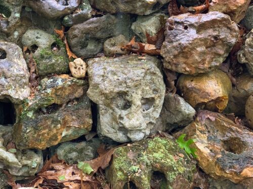 Tom Hendrix stacked these rocks together because they look like faces at Tom's Wall.