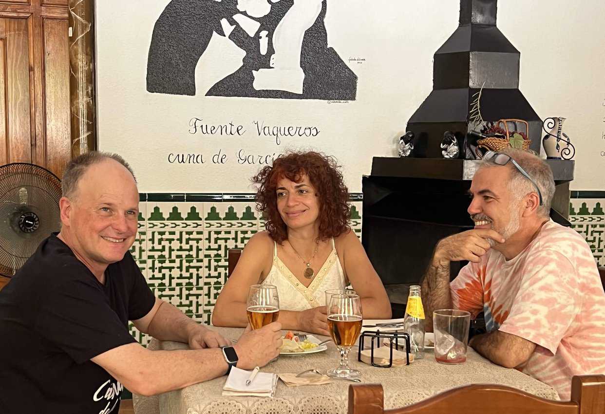 Granada native Sergio Romero Gonzalez (right) enjoys food and conversation in a restaurant in Fuente Vaquero
