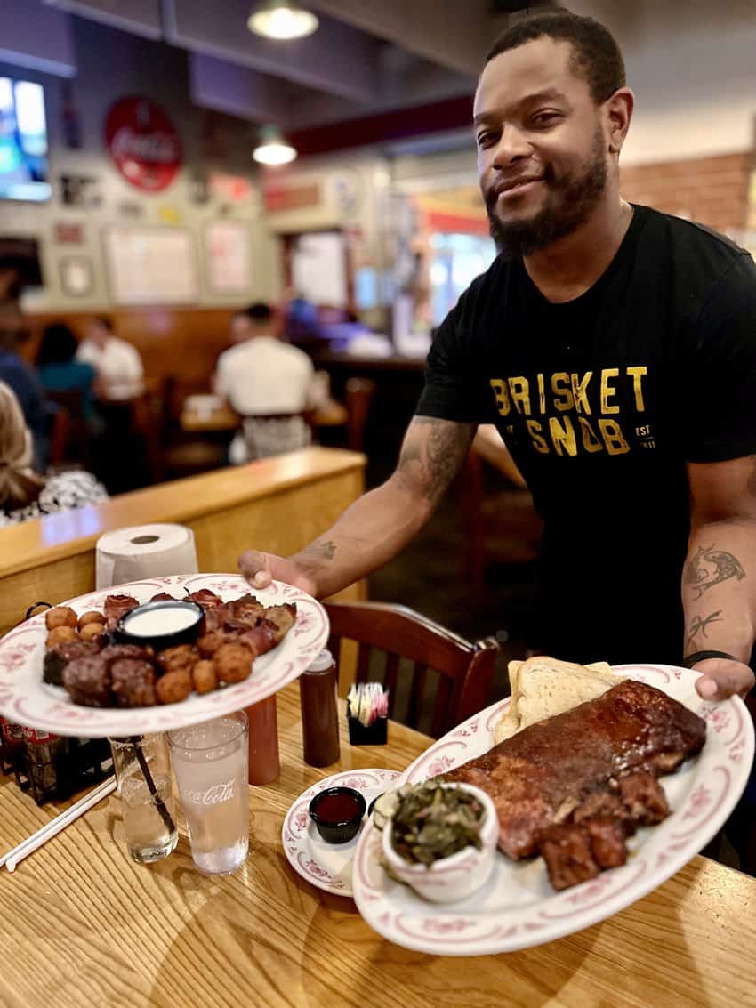 MidWood Smoke House waiter KaRonn knows a thing or two about barbeque. 
