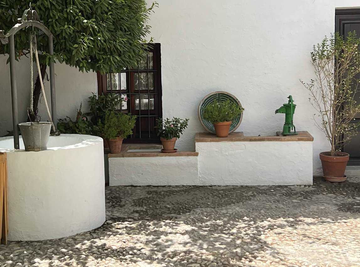The patio and well at the birthplace of Garcia Lorca in Fuente Vaqueros.