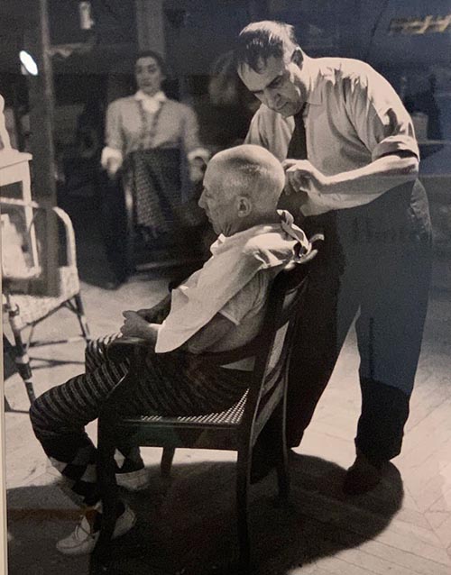 A photo of Picasso and his longtime barber and confidant Eugenio Arias. The photo is displayed in the Picasso Museum Eugenio Arias Collection.